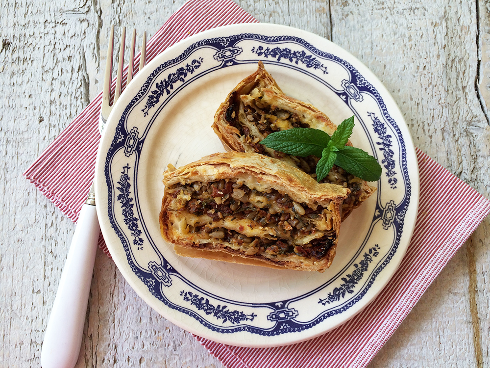Phyllo cheese pie in a loaf pan with sundried tomatoes