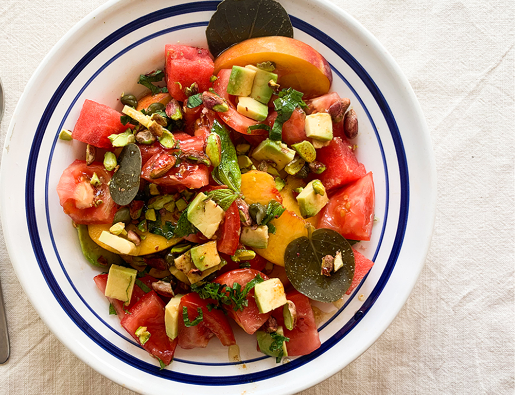 Greek Salad with Heirloom Tomatoes, peaches, watermelon, tomatoes, capers and pistachios
