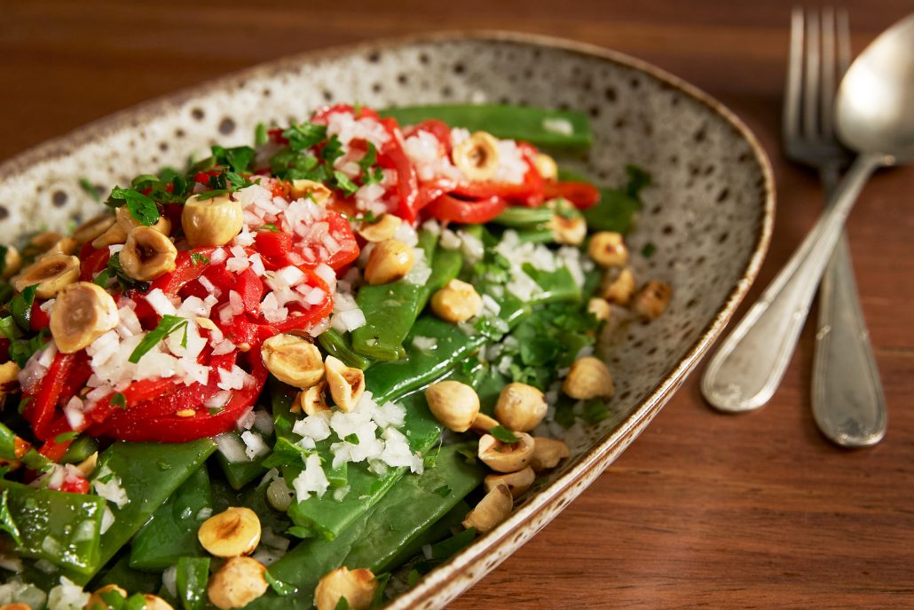 Warm Green Beans with Chopped White Onion And Hazelnuts