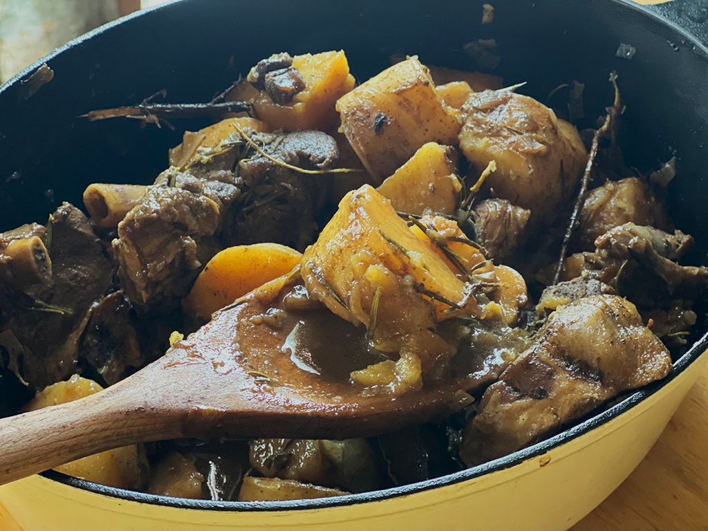Lemony Braised Goat recipe by Diane Kochilas.