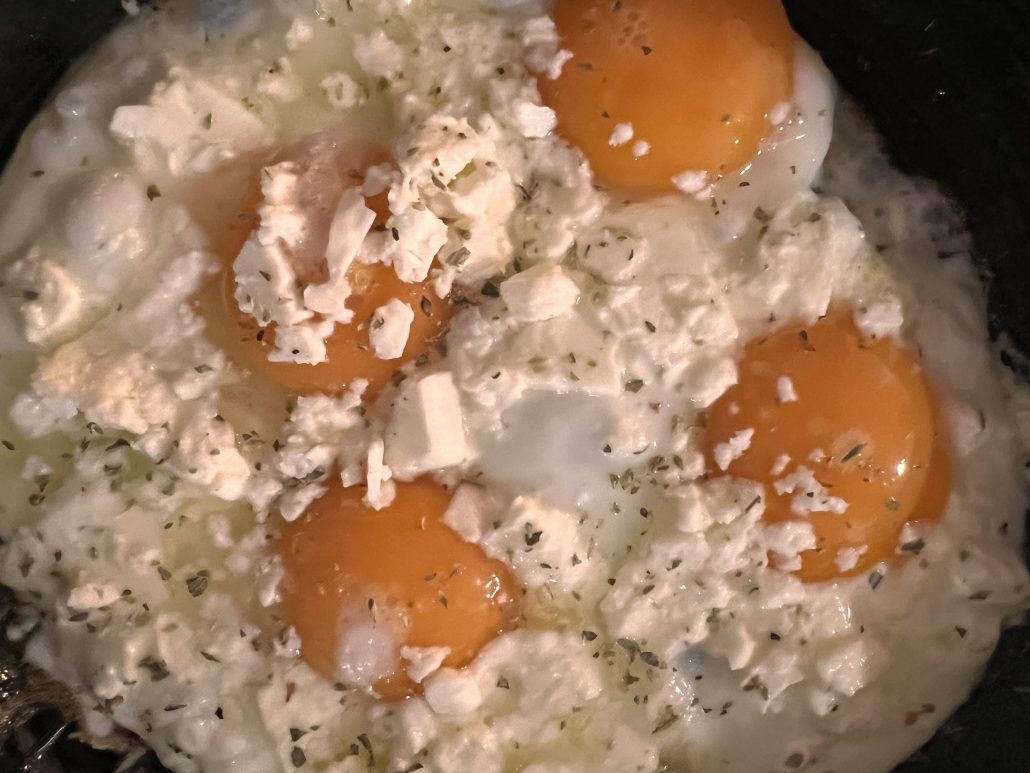 Sunny Side up eggs with Feta cheese on top, cooked in extra virgin olive oil. A recipe by Diane Kochilas.
